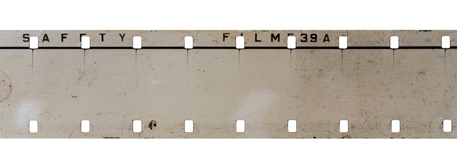 real detail shot of 16mm film strip on white background, cine film macro photo.
