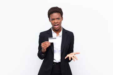 young pretty black womanlooking angry, annoyed and frustrated screaming wtf or what‚Äôs wrong...