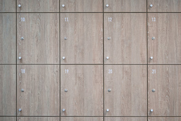 Wooden lockers in locker room at office.