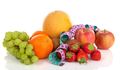 Diet scenery with fresh fruit over white background