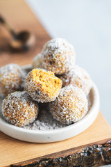 Healthy Organic Gluten and Sugar Free Dessert of Carrot Balls, Coconut flacks and nut Creme