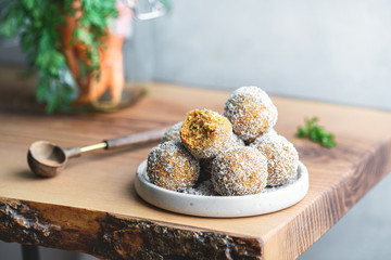 Healthy Organic Gluten and Sugar Free Dessert of Carrot Balls, Coconut flacks and nut Creme