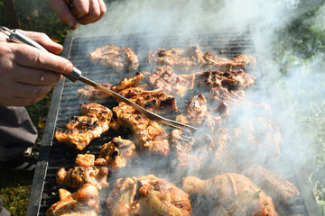 Meat on the grill. Chef cooking grilling mix of fresh grilled chicken meat