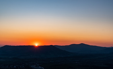 sunrise with silhouette of mountains in Beskydy mountains, Czech Velky Javornik