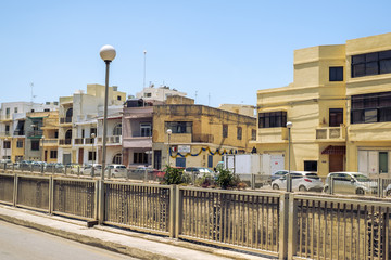 Traditional Maltese architecture in Albert city in Malta, street with traditional balconies and old buildings in historical city of Malta.