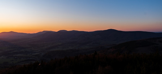 sunrise with silhouette of mountains in Beskydy mountains, Czech Velky Javornik