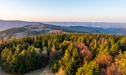 sunrise in the valley of a beautiful green field in spring with fog, Czech Beskydy Frenstat pod Radhostem