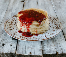 pancakes on a plate with raspberry jam
