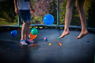 children playing on trampoline 