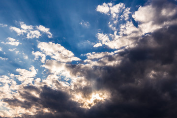 Obraz premium background with blue sky furrowed by gray clouds