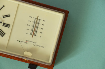 old soviet table clock in a wooden frame lie on the table