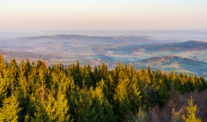 sunrise in the valley of a beautiful green field in spring with fog, Czech Beskydy Frenstat pod Radhostem
