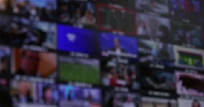 Mosaic Of TV Channels, Choose Between Many Thumbnails On A Television. Blurred Background. Close Up View - DCi 4K Resolution
