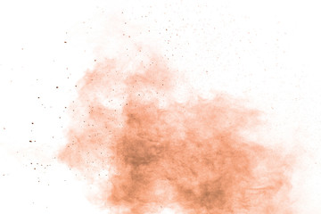 Freeze motion of brown powder exploding. Abstract design of brown dust cloud against white...