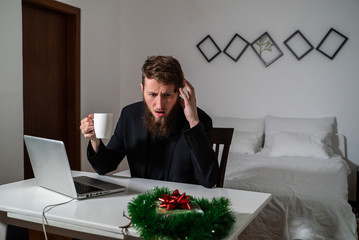 Man working forgot about chrismas night a authentic room.