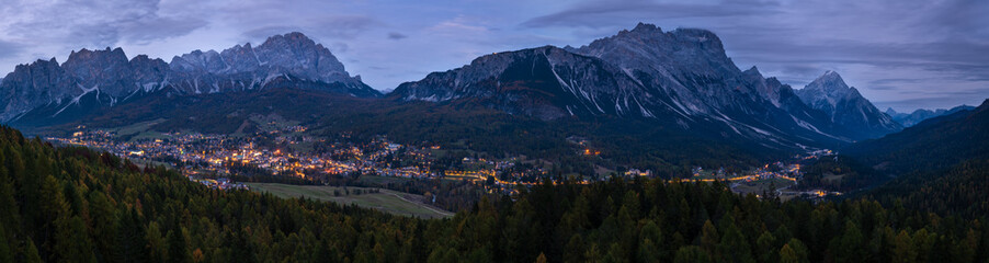 Fototapeta premium Autumn night Cortina d'Ampezzo Dolomites mountain town, Belluno, Italy.