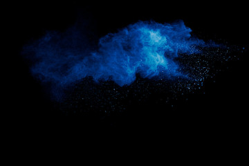 Fototapeta na wymiar Blue powder explode cloud on black background.Launched blue dust particles splash on background.