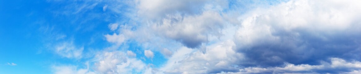 Panorama of a blue sky with impending thunderstorm clouds. Heaven natural background. Banner, blank. Weather,  meteorological reports. Free space for text
