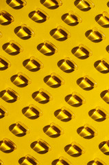 Wallpaper Omega 3 capsules on yellow background