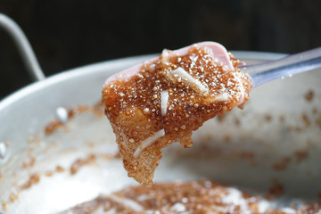 Tapioca pearls form sago tree. Still life photography of Thai dessert Sago palms with coconuts or sago pearls in coconut milk on the table. Popular dessert in Thailand served with fresh coconut milk.