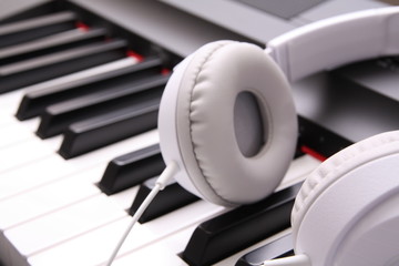 Headphones on piano keyboard