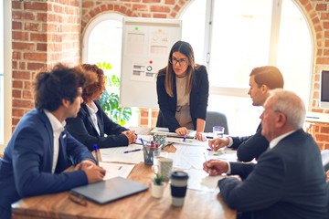 Group of business workers working together in a meeting. Listening one of them speaking at the office.