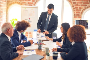 Group of business workers working together in a meeting. Listening one of them speaking at the office.