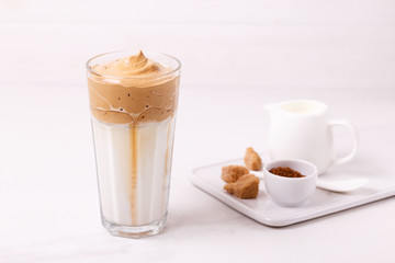 whipped dalgona coffee with milk and cane sugar. South Korean summer drink