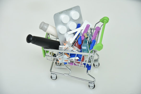 Shopping cart with lancet pen and syringes and pills, medicines
