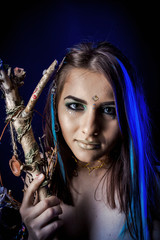 Fototapeta premium ethnic girl on a black background in blue light