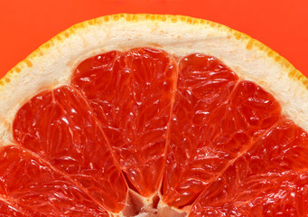 Close up texture background photo of orange red grapefruit pulp slice, sweet juicy healthy food....