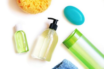 Green sanitizer gel, liquid soap, sponge, shampoo bottle. Hands washing, hygiene concept
