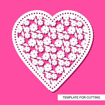 Openwork heart of flowers and leaves, cut out of paper. Cute Valentine February 14 or wedding. Silhouette white object on a pink background. Template for plotter laser cutting. Vector illustration.