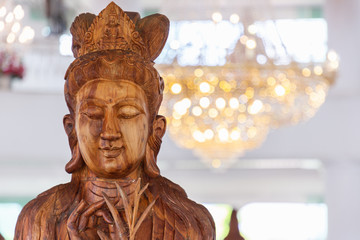 Beautiful wood statue of Guan Yin at Huay Pla Kang Temple, Chiang Rai, Thailand.