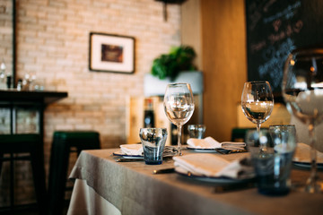 Restaurant glass tableware on the table interior