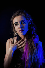 Girl in werewolf style on a black background with blue light