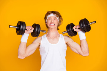 Close-up portrait of his he nice attractive funky self motivated guy sportsman lifting heavy...