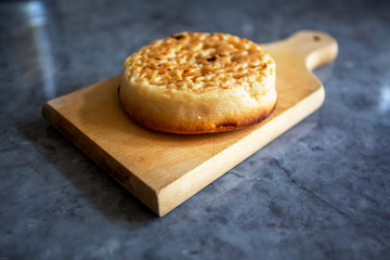 Crumpets on Wooden Board