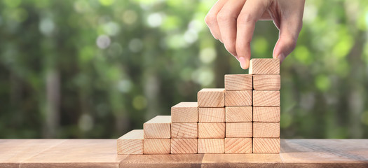 Hand liken person stepping up  toy staircase wood © denphumi