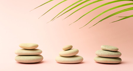  Zen background pink color with Japanese stones (stone towers) for spa, meditation and relaxation.