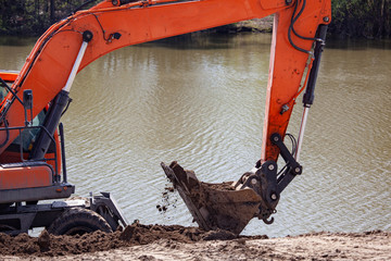 front end loader machine digging the earth