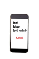 Fototapeta na wymiar Mobile phone isolated on white background with text on screen”Be safe,Be happy,Be with your family”,social distancing,preventing coronavirus through bacteria,stay at home.