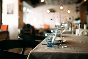 Restaurant glass tableware on the table interior