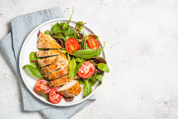 Chicken fillet with salad top view.