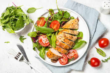 Chicken fillet with salad top view.