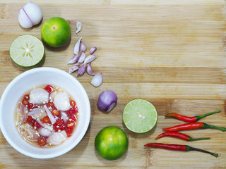 white bowl fish sauce and herb ingredients