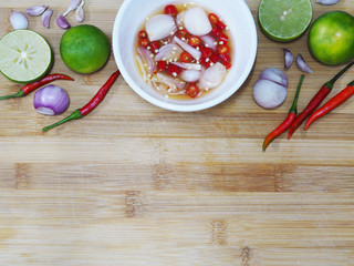 white bowl fish sauce and herb ingredients