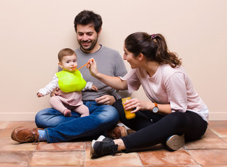 Baby and parents having lunch