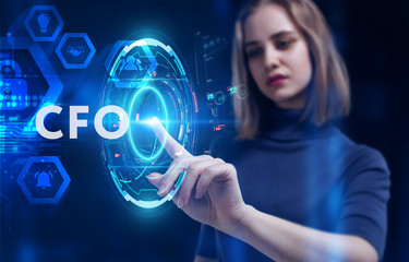 Business, Technology, Internet and network concept. Young businessman working on a virtual screen of the future and sees the inscription: CFO
