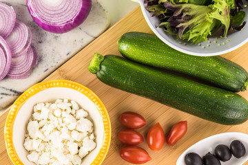 Spiral zucchini noodles salad with variety vegetables.
